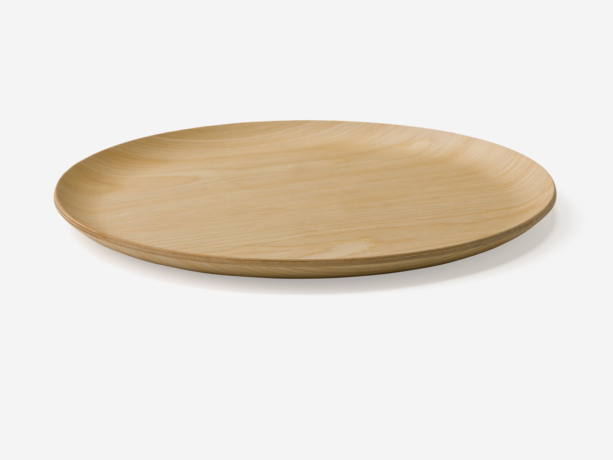 Side view of large round oak serving tray